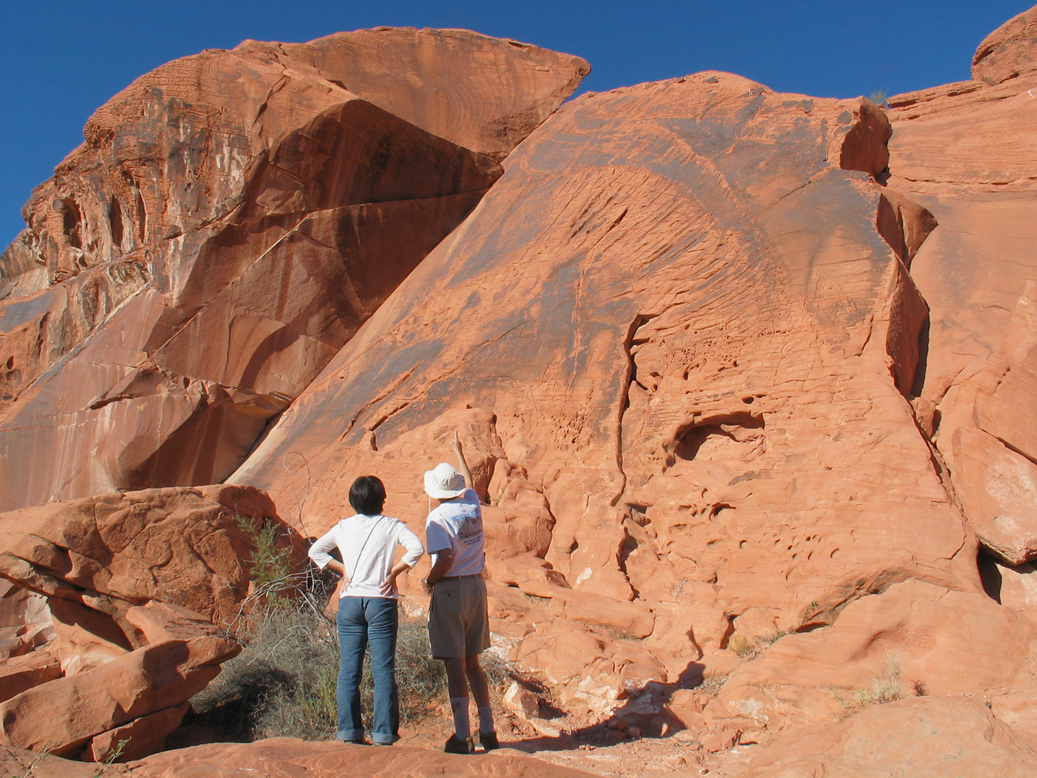 Coauthors in front of a joint surface at the Valley of Fire, 2003